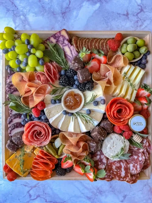 Charcuterie board with cheeses, cured meats, fruit and accompaniments | Always on Board